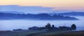 Fields and meadows under early morning fog - Podkarpacie region, Lesser Poland province, Poland Royalty Free Stock Photo