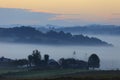 Fields and meadows under early morning fog - Podkarpacie region, Lesser Poland province, Poland Royalty Free Stock Photo