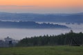 Fields and meadows under early morning fog in Podkarpacie region, Poland.