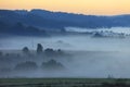 Fields and meadows under early morning fog in Podkarpacie region, Poland. Royalty Free Stock Photo