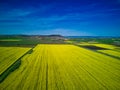 Fields with a plant in a valley against the background of the village and the sky in Bulgaria Royalty Free Stock Photo