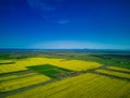 Fields with a plant in a valley against the background of the village and the sky in Bulgaria Royalty Free Stock Photo