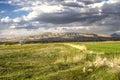 Darkened by spring storm clouds, the evening sky in the Ararat valley with the mountains of Gegham ridge visible in the distance Royalty Free Stock Photo