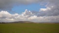 Fieldsin the Wallonian countryside, with terril hill in the background