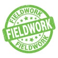 FIELDWORK text written on green round stamp sign