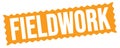 FIELDWORK text written on orange stamp sign