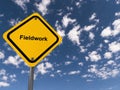 Fieldwork traffic sign on blue sky