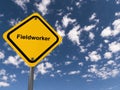 Fieldworker traffic sign on blue sky