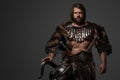 A fierce bearded Viking warrior in fur and light armor