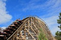 People experiencing a fierce wooden roller coaster ride