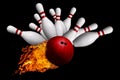 Fiery Ball Hitting Pins in Bowling Strike Isolated on Black Back Royalty Free Stock Photo