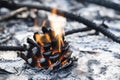 A fiery blaze burns in a pile of rocks, offering a warm glow Royalty Free Stock Photo