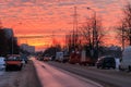 Fiery clouds sunset reflects in the wet asphalt Royalty Free Stock Photo