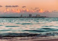 Fiery Farewell: Sun Dips Below Horizon in Dramatic Beach Sunset