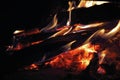 FIERY GLOW OF BURNING WOOD AND EMBERS OF A CAMPFIRE Royalty Free Stock Photo