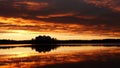 Fiery golden cloud covered sunrise at lake Ãâje in Dalarna in Sweden