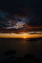 Fiery golden sunset in Montenegro over the sea. Near Sveti Stefan and the island of St. Nicholas, on the Budva Riviera. Royalty Free Stock Photo