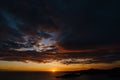 Fiery golden sunset in Montenegro over the sea. Near Sveti Stefan and the island of St. Nicholas, on the Budva Riviera. Royalty Free Stock Photo