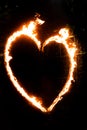 a fiery heart glows with a red flame at night. valentine's day and love symbol Royalty Free Stock Photo