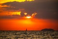 Fiery horizon, dramatic ocean sunset in vibrant hues over dark waters, nature breathtaking photo Royalty Free Stock Photo