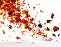 Fiery Orange Shards Exploding Against White Background Dynamic Motion Abstract Royalty Free Stock Photo