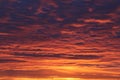 Fiery orange sky with scattered clouds Royalty Free Stock Photo