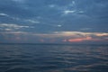 Fiery orange sunset sky and sea background.