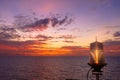 Fiery orange sunset sky warm light with clouds on the sea Beautiful for background with nav aids lamp on offshore oil and gas