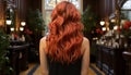 Fiery red curls cascade down a woman\'s back