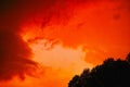 Orange and fiery red sky by storm brewing Royalty Free Stock Photo