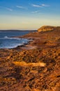 Fiery red wild sandstone coast at sunset, Western Australia Royalty Free Stock Photo