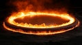 A fiery ring of flames burns brightly against a dark background Royalty Free Stock Photo