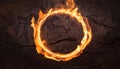 Fiery ring of flames on dark cracked background. Blurred motion. Abstract burning round shape Royalty Free Stock Photo