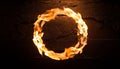 Fiery ring of flames on dark cracked background. Blurred motion. Abstract burning round shape Royalty Free Stock Photo