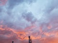 Fiery skies lined by purple clouds