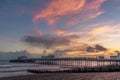 A fiery sky above the beach and pier at Worthing, Sussex, UK at sunset Royalty Free Stock Photo