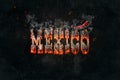 Fiery and smoking word Mexico on black asphalt background