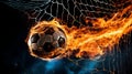 Fiery soccer ball flying into the goal with burning net in flames, dramatic sports concept Royalty Free Stock Photo