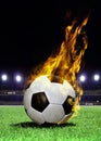 Fiery soccer ball on stadium