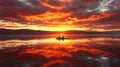 Fiery Sunset Kayaking Silhouettes of Adventurers on a Tranquil Lake with Dramatic Sky Reflections Royalty Free Stock Photo