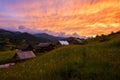 Fiery sunset over the alpine village, nature landscape