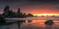 Fiery sunset over Castle Rock Formation at Bandon Beach in Oregon. Royalty Free Stock Photo