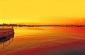Fiery sunset on swan river with jetty-perth Royalty Free Stock Photo