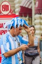 The 2018 FIFA World Cup. Argentine fan in striped white-blue t-shirt in colors of the flag of Argentina and in the original fan h Royalty Free Stock Photo