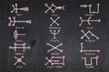 The Fifteen Behenian Stars glyphs used in Astrology an magic drawn on a blackboard