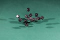 Fifteen black dices falling on a green table Royalty Free Stock Photo