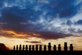 Fifteen standign moai against dramatic evening sky