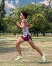 Fifteen-year-old Amerasian boy running a five kilometer 5K cross country race at Eldon Lyon Park in Bethany, Oklahoma.