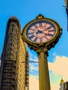 Fifth Avenue Building Clock near Flatiron building in background.