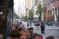 Fifth Avenue before Veterans Day Parade in NYC. People on sidewalk waiting for the Parade to begin, Police Officers securing the